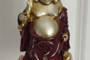 The Hotei (Laughing Buddha) figurine is a talisman of wealth and good fortune.