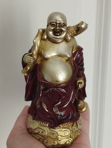 The Hotei (Laughing Buddha) figurine is a talisman of wealth and good fortune.