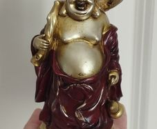 The Hotei (Laughing Buddha) figurine is a talisman of wealth and good fortune.