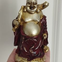 The Hotei (Laughing Buddha) figurine is a talisman of wealth and good fortune.