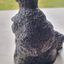 The figurine is a bears sculpture, manufactured by Wolf Originals in Canada. Image 4