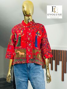 A gorgeous, rich tapestry/boho style with floral embroidery details, animal motifs with a structured mandarin/mock collar, and relaxed wide sleeves