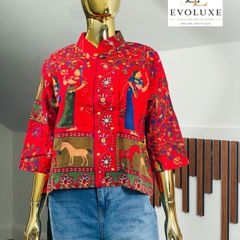 A gorgeous, rich tapestry/boho style with floral embroidery details, animal motifs with a structured mandarin/mock collar, and relaxed wide sleeves