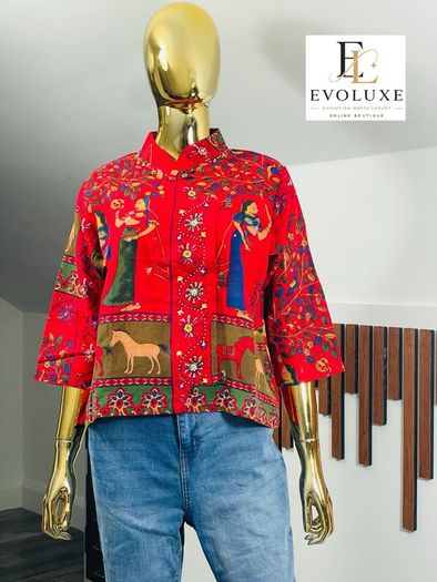 A gorgeous, rich tapestry/boho style with floral embroidery details, animal motifs with a structured mandarin/mock collar, and relaxed wide sleeves