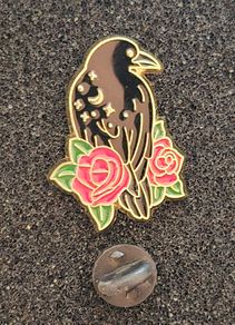 Raven and rose ,  pin back badge.