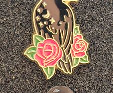 Raven and rose ,  pin back badge.