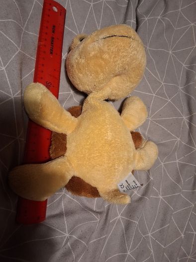 Turtle soft toy with large green eyes