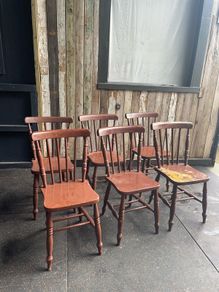 A set of 6 Victorian painted Elm stick back kitchen chairs.