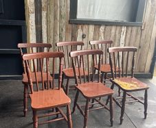 A set of 6 Victorian painted Elm stick back kitchen chairs.