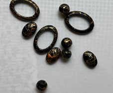 Beads black with gold