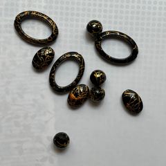 Beads black with gold