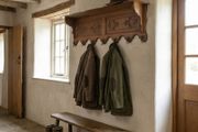 Old carved oak coat rack and hat shelf.