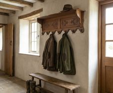 Old carved oak coat rack and hat shelf.
