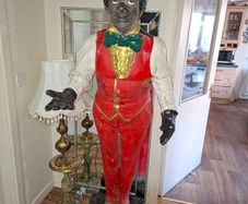 1920s Life-size Antique Sculpture in the form of a Butler, This extraordinary work of art, dating from around 1920, captivates with its impressive size and attention to detail. just Over 6 feet tall.,