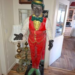 1920s Life-size Antique Sculpture in the form of a Butler, This extraordinary work of art, dating from around 1920, captivates with its impressive size and attention to detail. just Over 6 feet tall.,