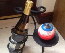 NEW Cast Iron Wine holder with new bottle of wine and new candle included