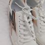 Runners in white with gold and grey lightning bolt on side Image 2