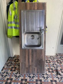 Kitchen sink with tap