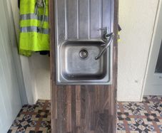 Kitchen sink with tap