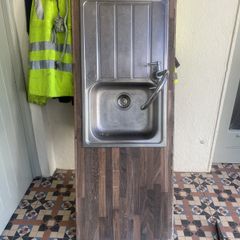 Kitchen sink with tap