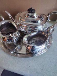 Vintage from the 19th century. Antique Period English Tea Service inc Teapot, Sugar bowl & milk jug Sheffield England on small silver plated tray.