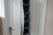Grey fabric hanging closet organizer with 6 open shelves and side mesh pockets