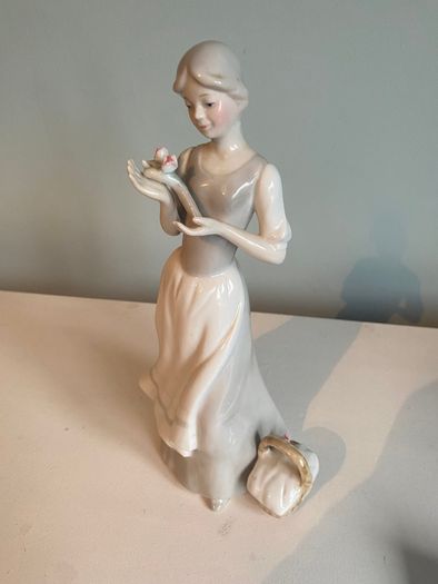 Porcelain 10 inch  figurine of a lady