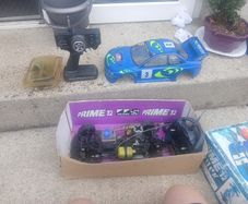 R/C Subaru car for parts + 2 controls