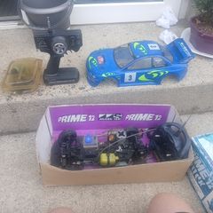 R/C Subaru car for parts + 2 controls