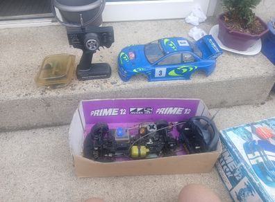 R/C Subaru car for parts + 2 controls