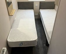 2 x single compact beds and mattress