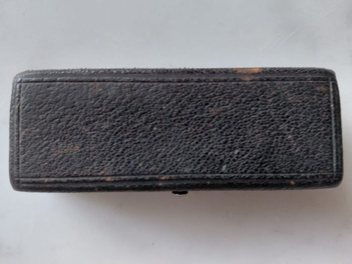 Antique medical syringe in original box