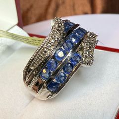 Silver ring with sapphires and diamonds.
