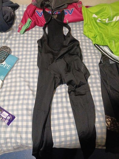 2 cycling shirts 1 is cube worth easily 50 euro and is brand new and pants with padding for on the saddle brand new never worn the second shirt is the official astana team training shirt also brand new  is the  would like to sell all together for a good p