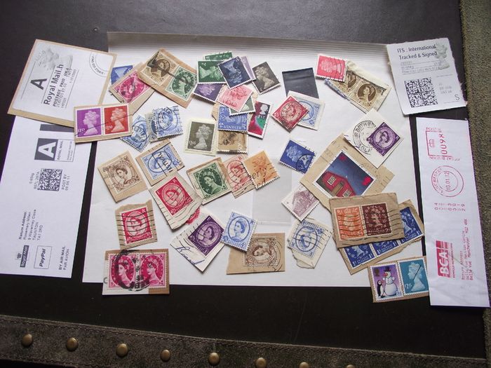 A box with collection of stamps from Great Britain