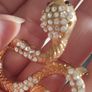 A striking snake-shaped brooch. Image 5