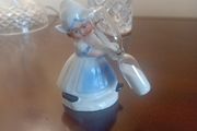 vintage porcelain egg timer featuring a dutch girl in traditional dress