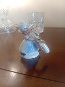 vintage porcelain egg timer featuring a dutch girl in traditional dress