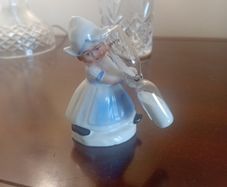 vintage porcelain egg timer featuring a dutch girl in traditional dress