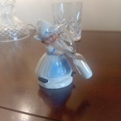vintage porcelain egg timer featuring a dutch girl in traditional dress