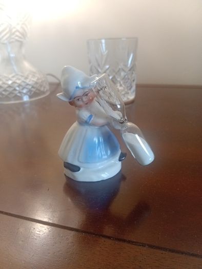 vintage porcelain egg timer featuring a dutch girl in traditional dress