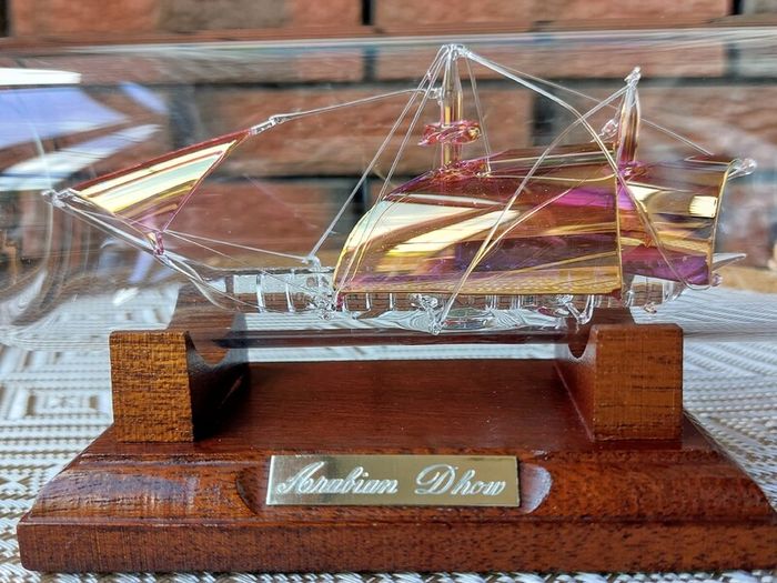 Blown Glass "Arabian Dhow" Sailing Ship Housed in Clear Glass Bottle.