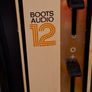 Ideal Prop, Vintage Working Boots Audio TV12 Portable Black and White CRT Television, featuring a cream plastic casing with side control dials and a 12 inch screen. Designed with dual power capabilities supporting standard mains voltage (240V) as well as  Image 6