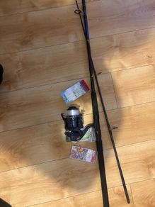 fishing rod and reel read to go sea mackrell pollock rock fishing