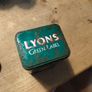 This vintage Lyons Green Label tea tin is a collectible item. Image 2
