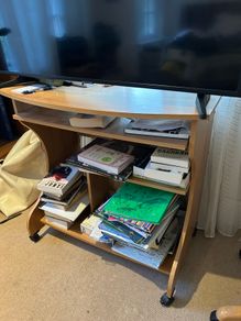 Wooden TV stand with wheels and storage shelves