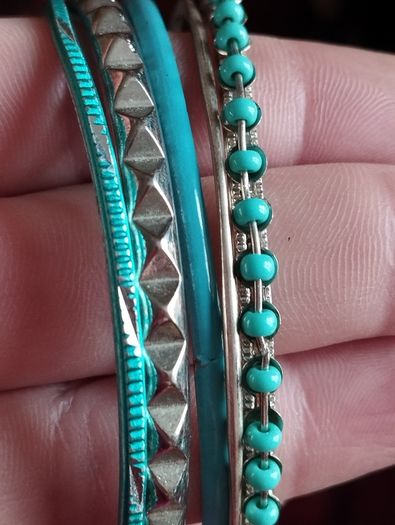 Charming bracelets in silver and blue tones.