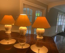 A pair of large Aynsley lamps and a matching slightly larger one. all 3 complete with lampshades.  Excellent condition