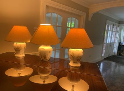 A pair of large Aynsley lamps and a matching slightly larger one. all 3 complete with lampshades.  Excellent condition