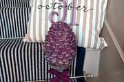 New bespoke oversized autumn Pinecone on distressed wood base in mulberry